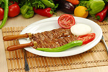 Cağ kebabı, served on a bico, or individual skewer
