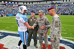 Hasselbeck with U.S. soldiers prior to kickoff at a game in November 2011. Operation Gameday Experience.jpg