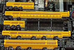 Four PCI Express bus card slots (from top to second from bottom: x4, x16, x1 and x16), compared to a 32-bit conventional PCI bus card slot (very bottom) PCIExpress.jpg