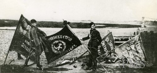 Polish soldiers displaying captured Soviet battle flags after the Battle of Warsaw in 1920