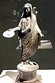 Image 10A Roman priest, his head ritually covered with a fold of his toga, extends a patera in a gesture of libation (2nd–3rd century) (from Roman Empire)