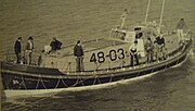 RNLB Ruby and Arthur Reed (ON 990). A photograph of the lifeboat taken during a launch from Cromer Station