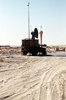 An M998 High-Mobility Multipurpose Wheeled Vehicle (HMMWV) carrying a radar and tracking system shelter sits parked at an airfield during Operation Desert Shield. The shelter is used by the Marines of the 3rd Remotely Piloted Vehicle (RPV) Platoon to track their Pioneer RPVs during flight. RQ-2 Pioneer radar and tracking system.JPEG