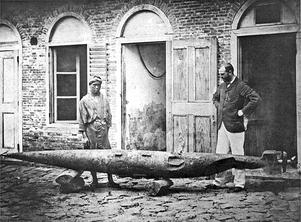 Robert Whitehead (right) and his son (left) with a battered test torpedo in Fiume, Austria-Hungary c.1875