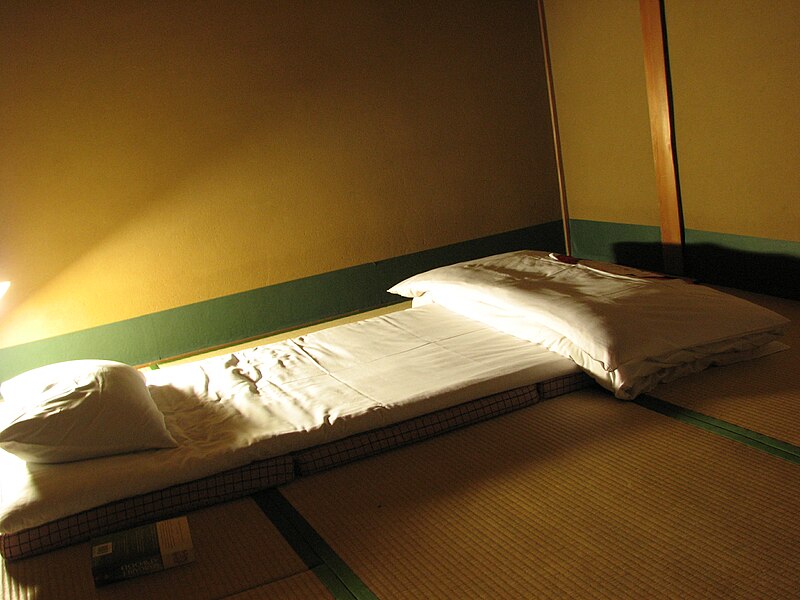 Description: This is what you get to sleep on in a ryokan; a mattress on the floor, a pillow stuffed with what feel like beans, and some beautiful quilting (which I didn't find until after this photo).
