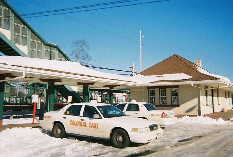 File:Sayville Station - Pedestrian Bridge and Taxicabs.jpg