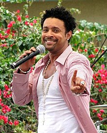 Jamaican reggae singer Shaggy earned his first and second number one singles "It Wasn't Me" and "Angel" in U.S. and stayed at the top for two consecutive weeks and one week respectively. Shaggy.jpg