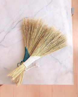 Two 'turkey tail' style brooms made from broom corn