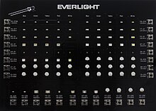 Image of miniature surface mount LEDs in most common sizes. They can be much smaller than a traditional 5 mm lamp type LED, shown on the upper left corner. Single and multicolor surface mount miniature LEDs in most common sizes.jpg