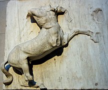 Sculpture of a man fighting a centaur.