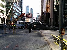 A film crew prepares a scene for the film Suicide Squad, on Bay Street, Toronto Suicide Squad filming in Toronto 3.jpg