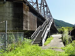 Station entrance on the north side of the bridge. The stairs lead to a walkway which runs along the length of the bridge.
