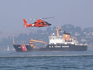 U.S. Coast Guard helicopter and Buoy Tender.jpg