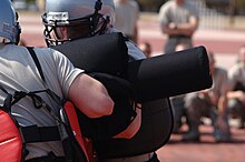 Trainees engage in a pugil stick bout USAF trainees at pugil stick fighting 2006.jpg