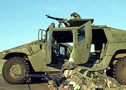 US Air Force (USAF) personnel assigned to the 48th Security Forces Squadron, simulate laying down a base of fire using a 7.62mm M60 general purpose machine gun mounted atop a M1038 - DPLA - e785c2ff2428814893690fcd35669738.jpeg