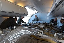 C-40A transporting palletized humanitarian cargo, 2005. US Navy 050108-N-6954B-023 Crew members load supplies onto a C-40A Clipper aircraft assigned to the "Lone Star Express" of Fleet Logistics Support Squadron Five Nine (VR-59).jpg