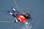 Miniatuur voor Bestand:US Navy 060406-N-4772B-041 During a man overboard drill, search and rescue (SAR) swimmer, Yeoman 3rd Class Francisco J. Degollado secures the ship's training manakine.jpg