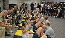 LBHS NJROTC at a competition at J. W. Mitchell High School US Navy 101016-N-7361H-004 Navy Junior ROTC students from Lemon Bay High School perform sit-ups during the sit-up competition at the 3rd annual Mit.jpg