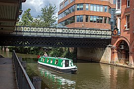 Narrow boat passing Onslow Bridge in Guildford