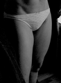 Window light on woman thigh and white panties.png