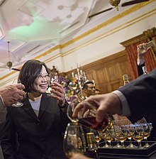 Tsai Ing-wen drinking whisky at a National Day drinks reception, 2016 10.10 Zong Tong Yu Sheng Wen Sen Guo Zong Li Kang Li Yu Guo Qing Jiu Hui Pin Chang Wei Shi Ji  (30149331441) (cropped).jpg