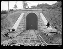 The west portal of the tunnel under Wilson Hill in Clinton on June 17, 1903. 1903-06-17 Central Massachusetts Railroad West Tunnel Portal Clinton MA.jpg