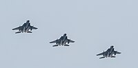 A formation of three F-15C/D Eagles overhead Kadena Air Base in Okinawa, Japan. The aircraft are assigned to the 18th Wing.