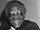 Aankomst SG Zuid-Afrikaanse raad van Kerken, Desmond Tutu op Schiphol, na uitnodiging Nederlandse raad van Kerken, Desmond Tutu, Bestanddeelnr 931-3829 (cropped).jpg