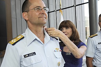 Adm. Charles D. Michel, Coast Guard vice commandant, is pinned with his new rank by his wife Claudia on June 1, 2016.