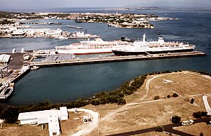 Aerial view of Windward Piers with the Military Sealift Command chartered vessel MEDITERRANEAN SKY (L), and the IVAN FRANKO (R). These ships were used in Jamaica for troop and Haiti - DPLA - eefcaf8cf65937ab6fb543c7c38114a7.jpeg
