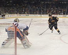 A shootout between the Providence Bruins (Boston Bruins AHL affiliate) and Bridgeport Sound Tigers (New York Islanders AHL affiliate) American Hockey League ERI 5728 (5528017555).jpg