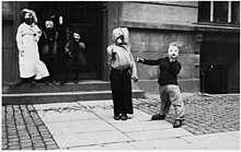 Costumed children walking door to door. Denmark 1930s. Boern rasleboesse 193x kgl bib billedsamling.jpg