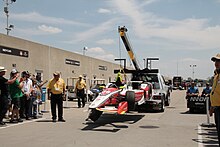 Bryan Clauson's damaged No. 88 Jonathan Byrd's Racing car, run in conjunction with KV Racing Technology. returning to the garage at the 2015 Indianapolis 500. Bryan Clauson 88 car - 2015 Indianapolis 500 - Sarah Stierch 2.jpg