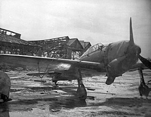 A captured Mitsubishi A6M5 Zero fighter at a Japanese airfield on Saipan. Captured A6M5 on Saipan 1944.jpeg