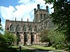 The south transept and tower of a Gothic stone cathedral