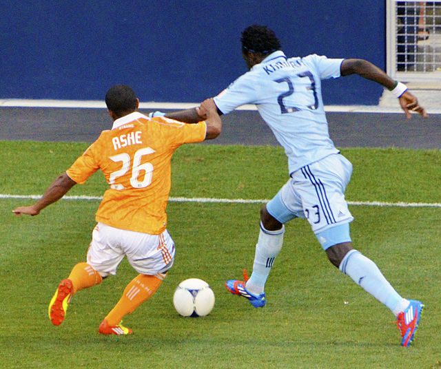 Ashe defending Kei Kamara of Sporting Kansas City during a game in 2012