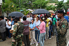Dominicans and Haitians lined up to attend medical providers from the U.S. Army Reserve Dominicans and Haitians Braving the Weather.jpg