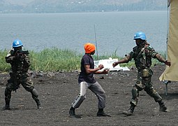 Elements of the Force Intervention Brigade of MONUSCO give a demonstration of their know-how in combat. The Brigade is mandated by the UN Security Council to neutralize all armed groups in eastern D.R. Congo. (9497173240).jpg