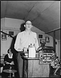 Thumbnail for File:Eli Sanders, pastor at the Pentecostal Church of God, he is a tipple worker and track loader at P V &amp; K Coal Company... - NARA - 541346.jpg