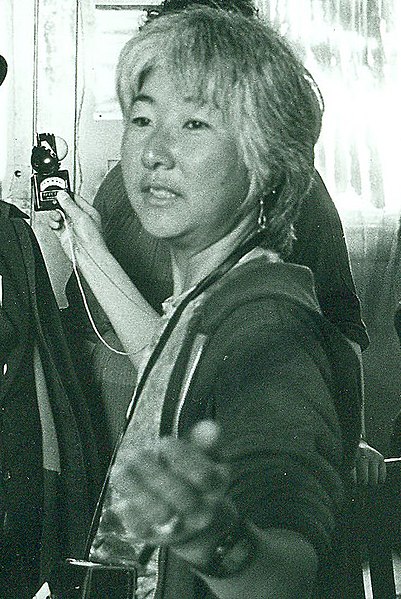 File:Emiko Omori takes a light reading off Victor Wong's face - cropped.jpg