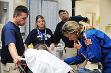 DMAT team deployed for Hurricane Ike in Texas FEMA - 38464 - DMAT team IOWA-1 assisting a resident in Texas.jpg