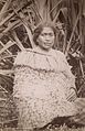 Māori woman wearing the traditional costume made of flax fibre, c. 1880