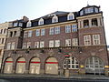 Fire station with outbuilding and hose tower in the courtyard