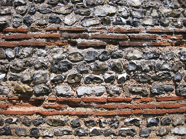 Wall of the Roman shore fort at Burgh Castle, Norfolk, with alternating courses of flint and brickwork