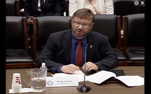 Executive Director Greg Scarlatoiu, giving testimony in April 2015, at the U.S. Congress' Tom Lantos Human Rights Commission, on the topic "North Korea's Forced Labor Enterprise: A State-Sponsored Marketplace in Human Trafficking". Greg Scarlatoiu, Executive Director, Committee for Human Rights in North Korea.png