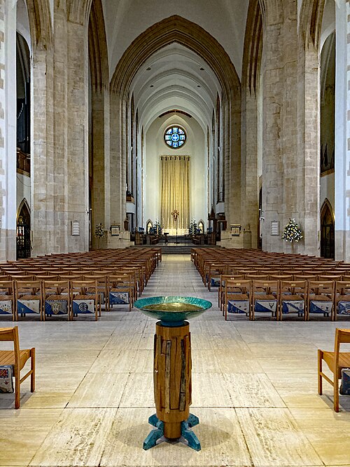 Nave interior, note the kneelers on the back of the chairs