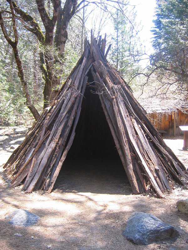 A Sierra Miwok cedar bark umuucha cabin reproduction in Yosemite Valley. The material came from lumbering operations of 19th century miners. Previousl