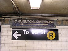 An original mosaic, directing passengers toward the 95th Street-bound platform, is located above modern signage. Image of sign pointing to 95th Street at 53rd Street.jpg