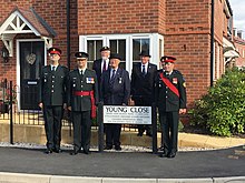 Members of Canadian Grenadier Guards and Kiddermionster City Council unveil the JF Young, VC road on 3rd September, 2018 JF Young VC memorial.jpg