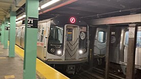 A Kawasaki R160B northbound F train arriving at Forest Hills-71 Avenue. Kawasaki R160B-2 (Siemens) on the F train. (71 Ave).jpg